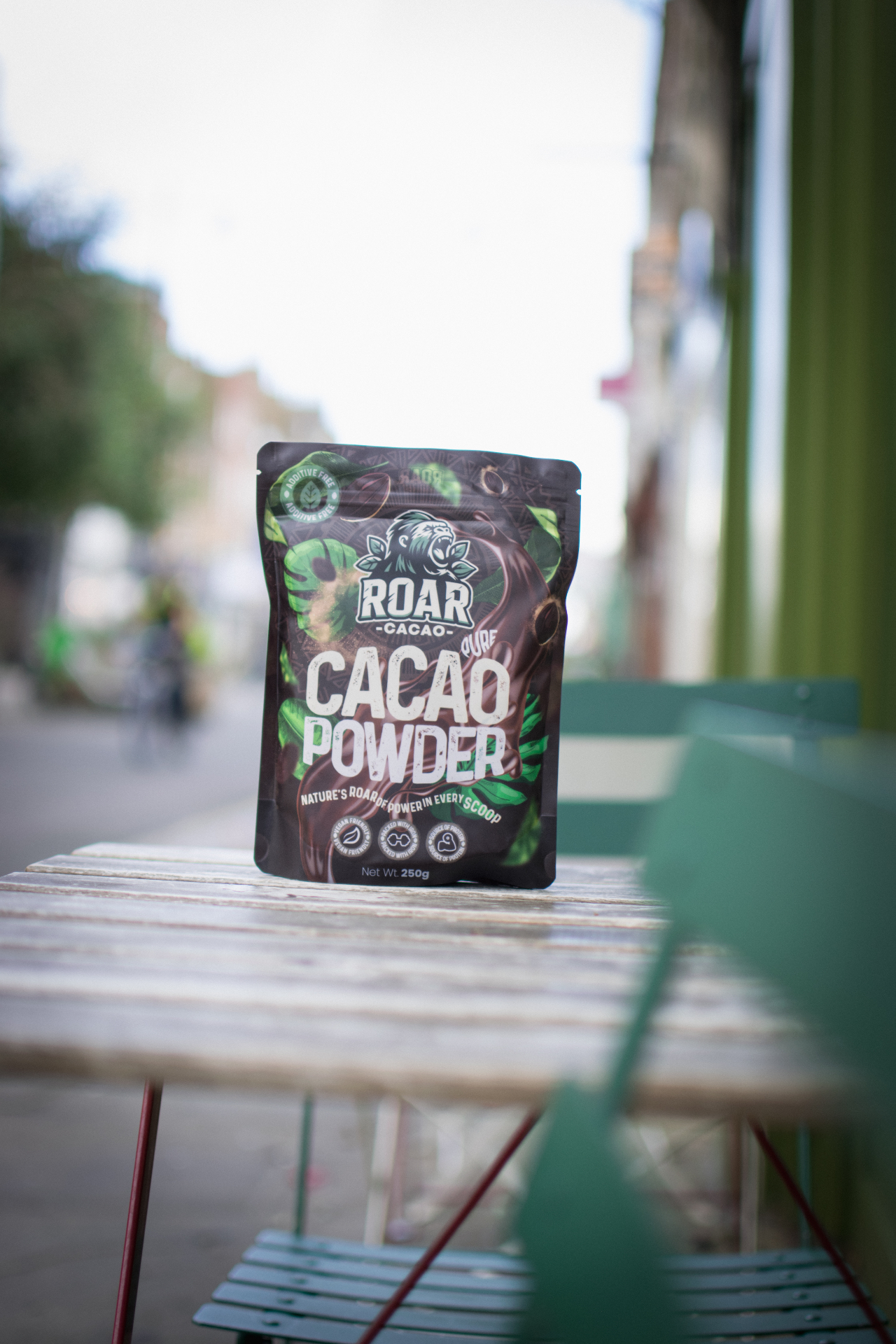 Roar Cacao pouch on a cafe table on a London street