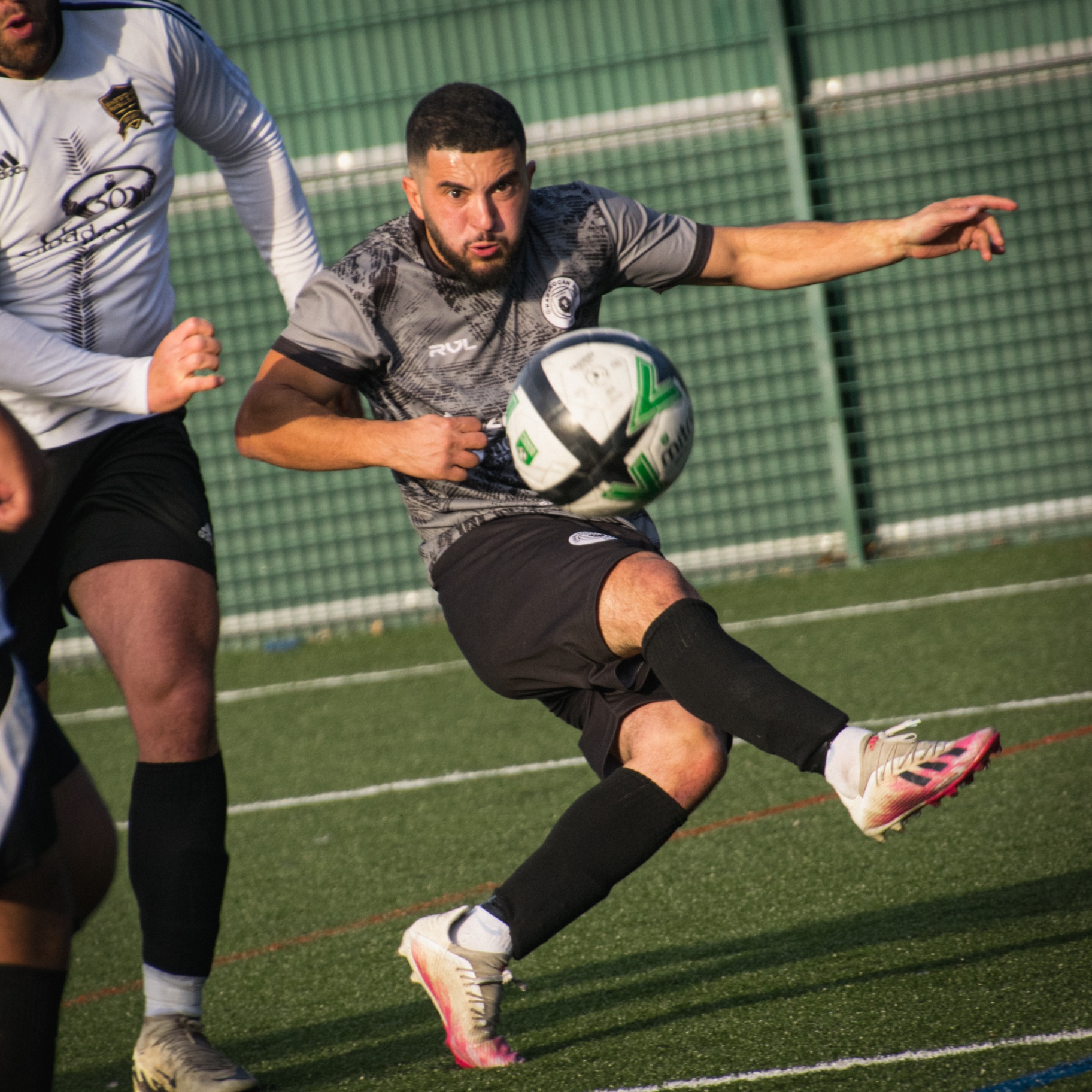 Player striking through the ball in close-up