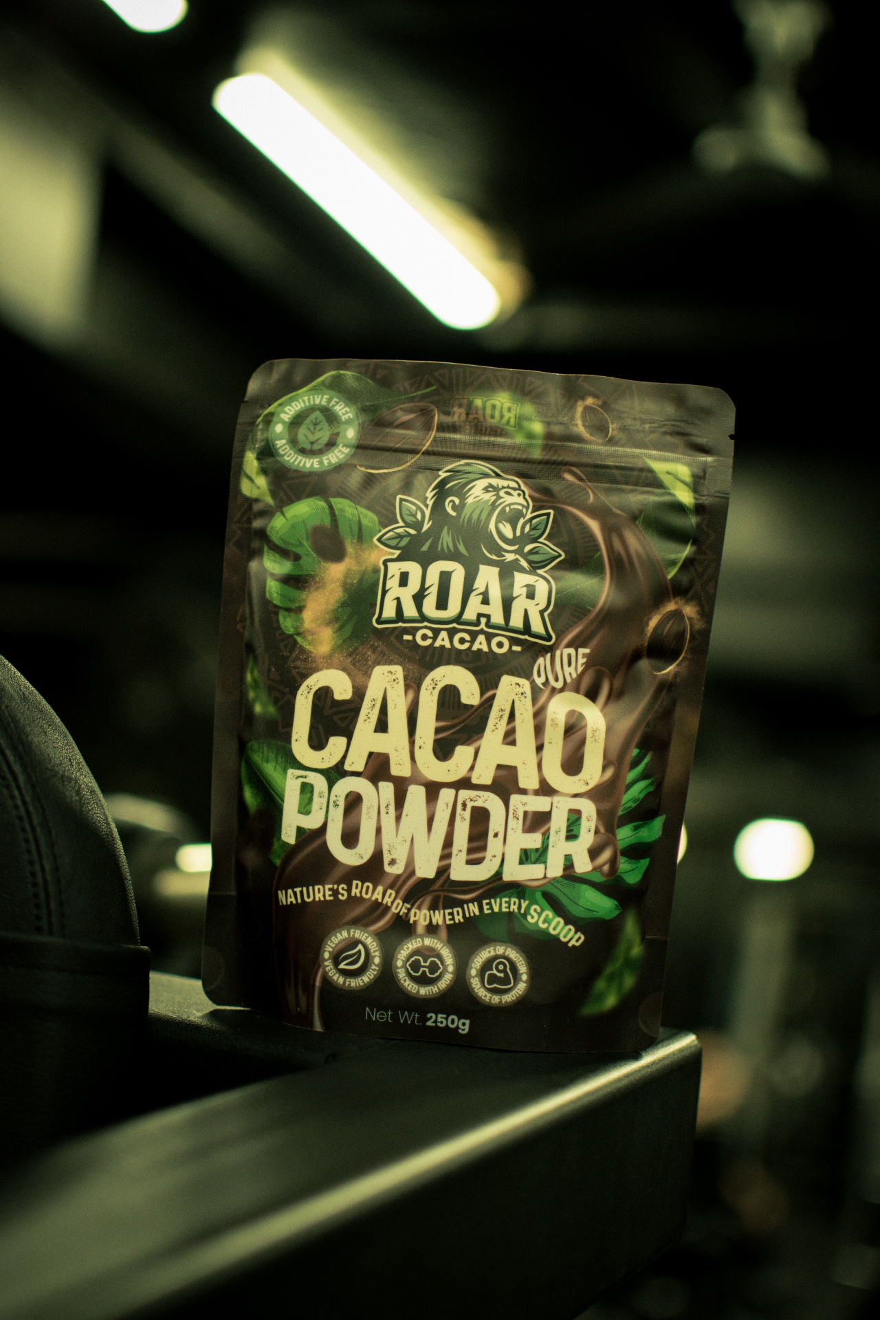 Roar Cacao pure cacao powder pouch under industrial lighting